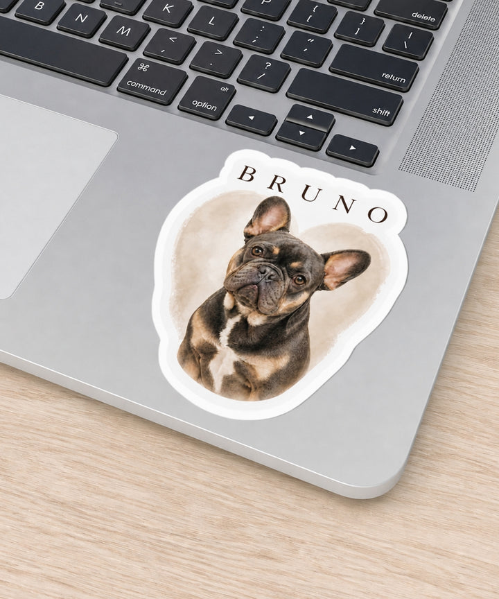 Custom die-cut dog sticker with personalized pet portrait artwork on a laptop